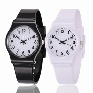 Minimalist black and white quartz watches with silicone straps and clear numeric dials
