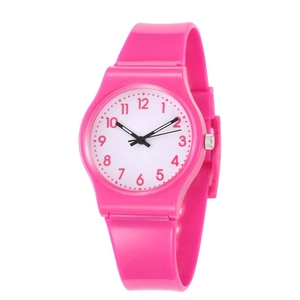 Detail of a bright pink quartz watch with silicone strap and white dial