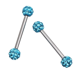 Macro detail of silver barbell nipple rings featuring light blue sparkling zircon stones