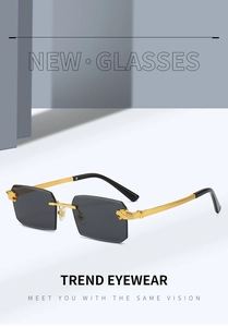 Detail of gold metal temples with lion head relief on rimless oversized sunglasses