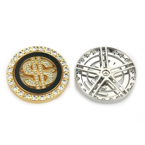 Rotating crystal dollar sign accessory in gold finish with sparkling rhinestone inlay