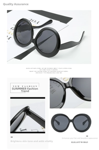 Detail of oversized retro round sunglasses with polished frames and metal hinge details