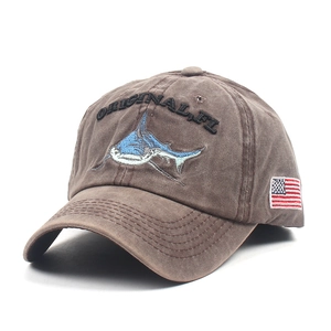 Close-up of the vintage washed cotton baseball cap with shark embroidery and US flag detail