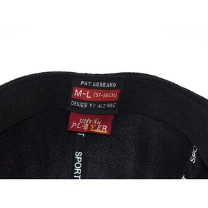 Interior view of black baseball cap with size label and internal seam tape construction