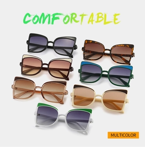 Flat lay of butterfly-shaped oversized sunglasses in multiple trendy colors with metal accents