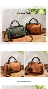 Detail of vintage solid color pillow bag with retro floral charm and rustic bronze hardware