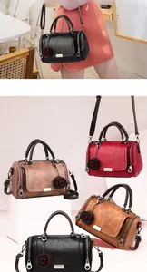 Detail view of retro pillow bags in four colors with floral charms and detachable straps