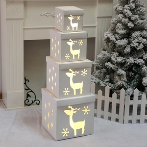 Set of 4 white Christmas hollow reindeer light boxes with warm LED glowing for holiday decor