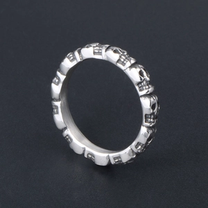 Polished silver titanium steel ring with engraved skull patterns and black vintage finish