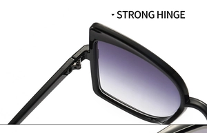 Detailed macro view of the strong hinge construction on butterfly sunglasses