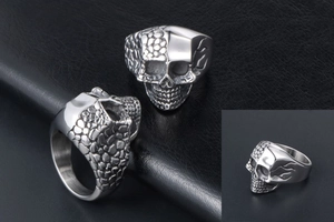 Detailed views of titanium steel skull ring with split smooth and scale texture finish