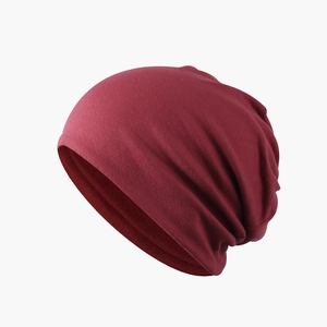 Solid red slouchy beanie hat for winter warmth with a soft fleece lining and modern style