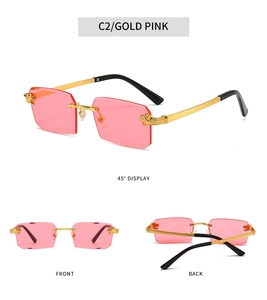 Detail view of pink rimless sunglasses with golden leopard head metal temples
