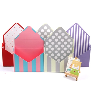Minimalist envelope flower gift box in colorful striped and polka dot paper patterns