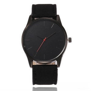 Close-up of minimalist black dial watch with red second hand and silver hour markers