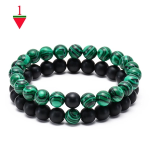 Detail view of malachite and matte agate beaded bracelets set for men and women