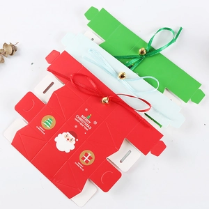 Christmas gift box set with ribbons and gold bells in red, green, and blue colors