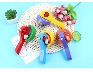 Detailed view of colorful wooden pull-string gyro toys with handles on a decorative mat