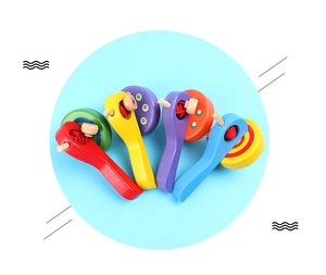 Macro view of four colorful wooden castanets for early childhood musical education