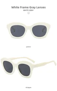 Front and 45-degree angle view of retro cat eye sunglasses with white frames and gray lenses