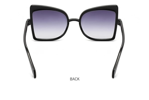 Detailed back view of oversized black butterfly sunglasses with purple gradient lenses
