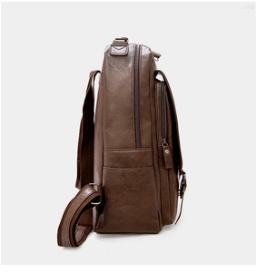Side view of dark brown PU leather backpack with lychee texture and dual zippers