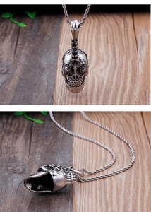 Macro view of gothic mechanical skull pendant with steampunk gears and twisted chain