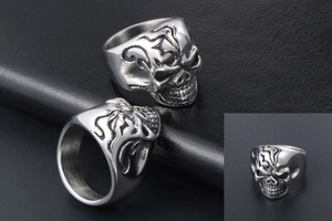 Detailed views showing the intricate side and front of a silver skull ring for men