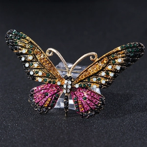 Detailed macro shot of alloy butterfly brooch with colorful inlaid rhinestones