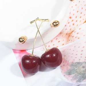 Sweet red cherry drop earrings with gold stems on a fresh white decorative background
