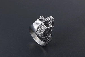Macro shot of skull ring side detail with unique pebble texture on stainless steel