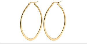 Detailed close-up of large oval gold hoop earrings featuring a flattened geometric design