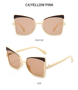 Detail view of butterfly cat-eye sunglasses in cream and yellow-pink lenses