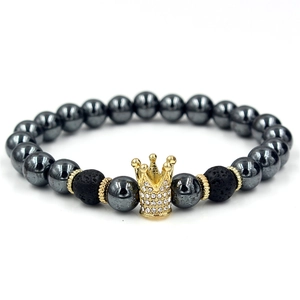 Fashion hematite and lava stone bead bracelet with a gold-plated pavé crown charm