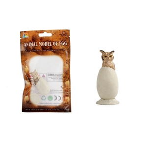 Detailed view of hatching owl egg toy model with retail packaging and realistic textures