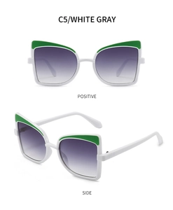 Front and side views of white butterfly sunglasses with green accents and gradient lenses