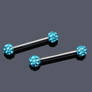 Detail of sky blue zircon paved crystal balls on surgical steel nipple rings