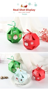 Detail of polyhedron Christmas gift boxes with ribbons and golden bells in various colors