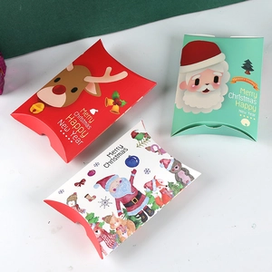 Three assorted Christmas reindeer and Santa themed pillow boxes for holiday gift wrapping