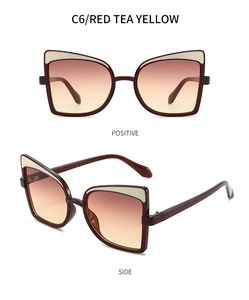 Macro detail of cat eye butterfly sunglasses with red tea yellow gradient lenses