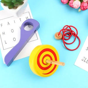 Classic wooden spinning top toy with purple handle and colorful spiral disk