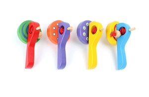 Set of four colorful wooden hand castanets toys for children on white background