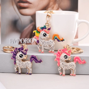 Detailed view of three unicorn keychains with sparkling rhinestones and colorful enamel