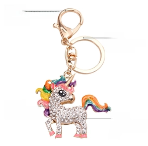 Close-up of unicorn keychain featuring rainbow enamel, sparkling rhinestones, and alloy lobster clasp