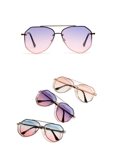 Detail view of retro oversized metal aviator sunglasses with colorful gradient lenses