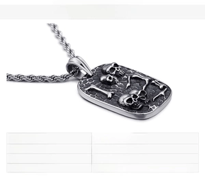 Detail of a punk skull pendant necklace in stainless steel with weight and material specs