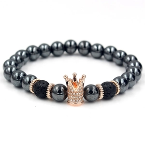 Men's hematite beaded bracelet with rose gold diamond crown and lava stones on white back