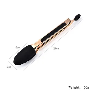 Gold-plated stainless steel food tongs with black silicone tips and locking mechanism