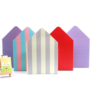 Five assorted envelope flower boxes in solid colors and stripes for floral gift packaging