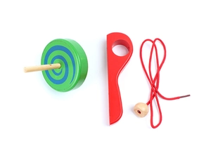 Detail view of colorful wooden pull string spinning top toy with red handle and blue spiral